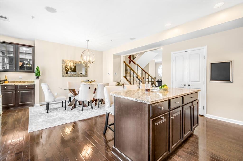 609 Rosecliff Road Wexford, PA 15090 - Photo 10 of 25 Kitchen-dining area with a large island, generously-sized pantry, built-in dry bar that is another upgrade option not in all units...nice touch for entertaining.