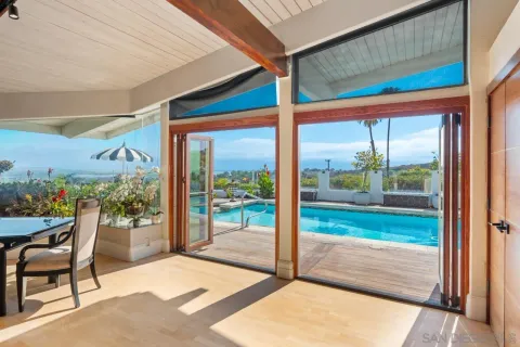 a view of a chairs and table in the patio