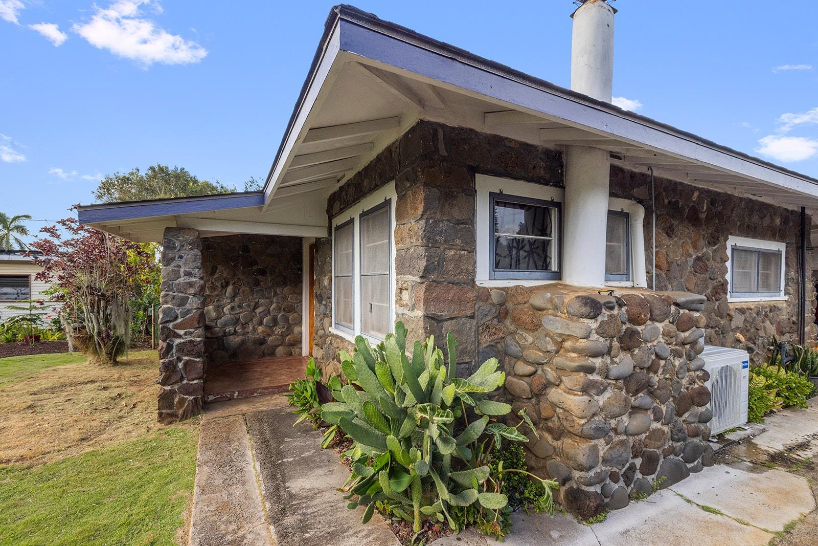 1697 Haiku Road Haiku, HI 96708 - Photo 2 of 48 a front view of a house with a yard