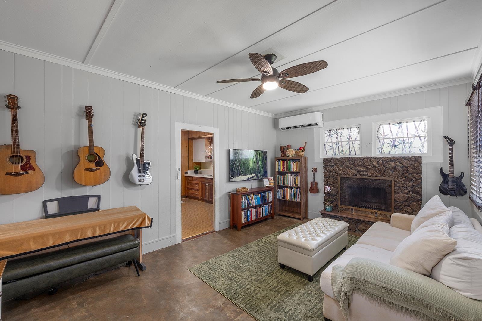 1697 Haiku Road Haiku, HI 96708 - Photo 3 of 48 a living room with furniture and a fireplace