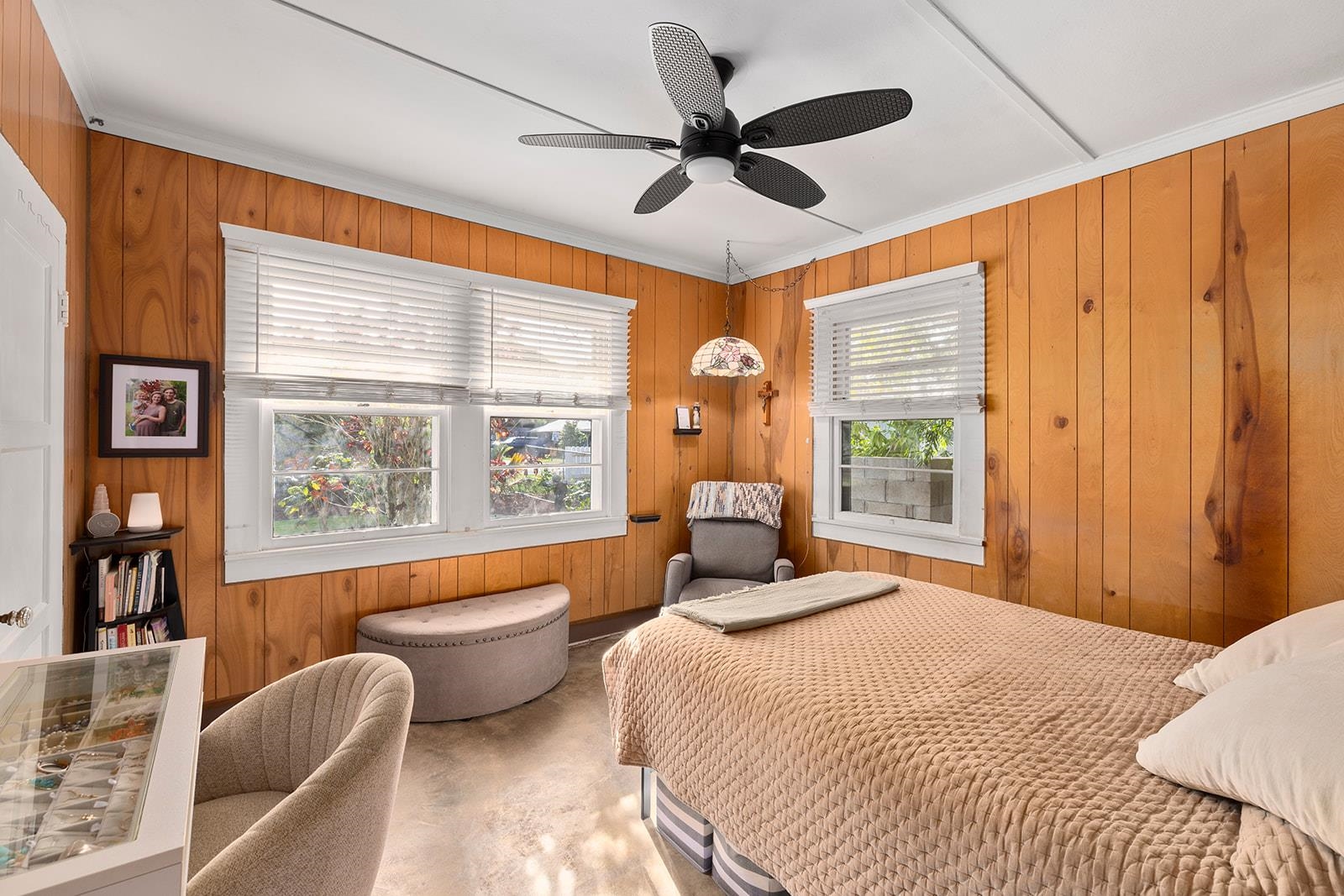 1697 Haiku Road Haiku, HI 96708 - Photo 7 of 48 a bedroom with a large bed and a large window with wooden floor