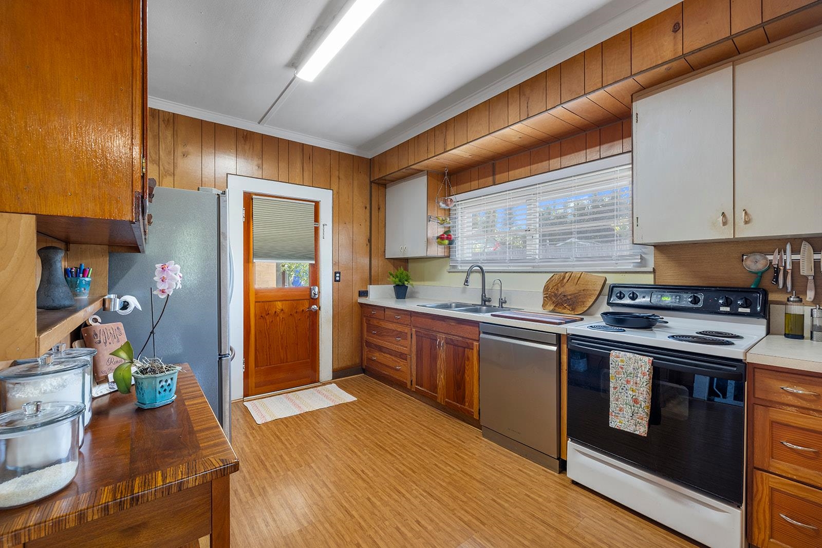 1697 Haiku Road Haiku, HI 96708 - Photo 10 of 48 a kitchen with stainless steel appliances granite countertop a stove a refrigerator and a sink