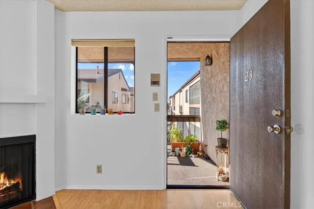 a view of an entryway with wooden floor