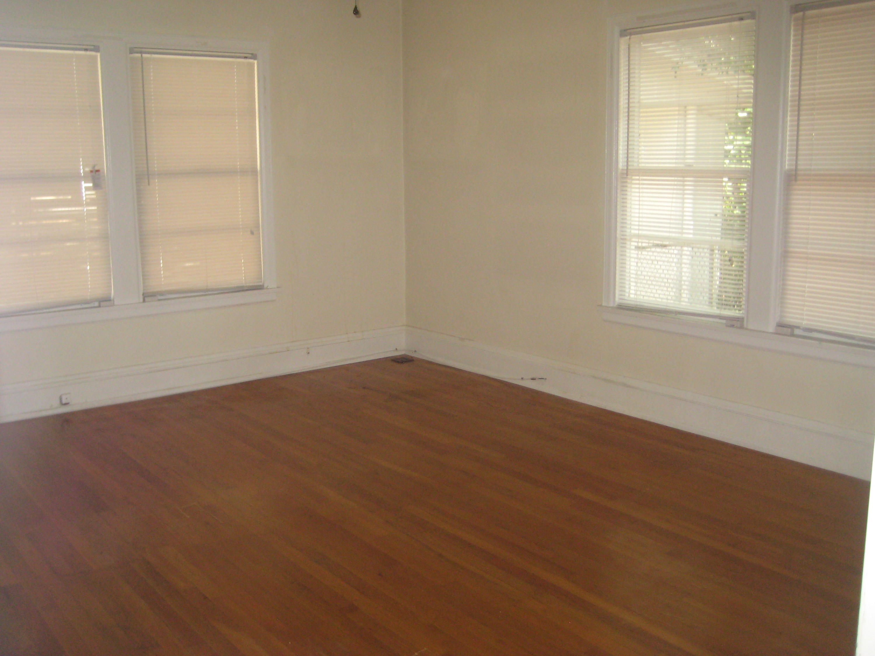 821 North Brett Street Crestview, FL 32536 - Photo 19 of 19 an empty room with wooden floor and windows