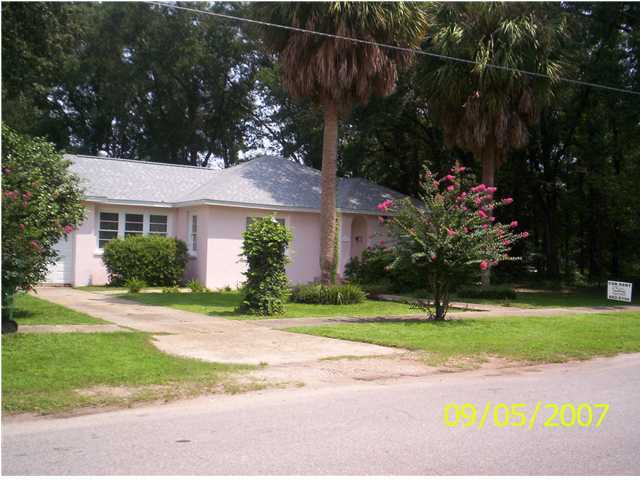 821 North Brett Street Crestview, FL 32536 - Photo 2 of 19 a view of a house with a yard and a garden