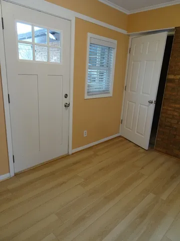 a view of a porch with wooden floor