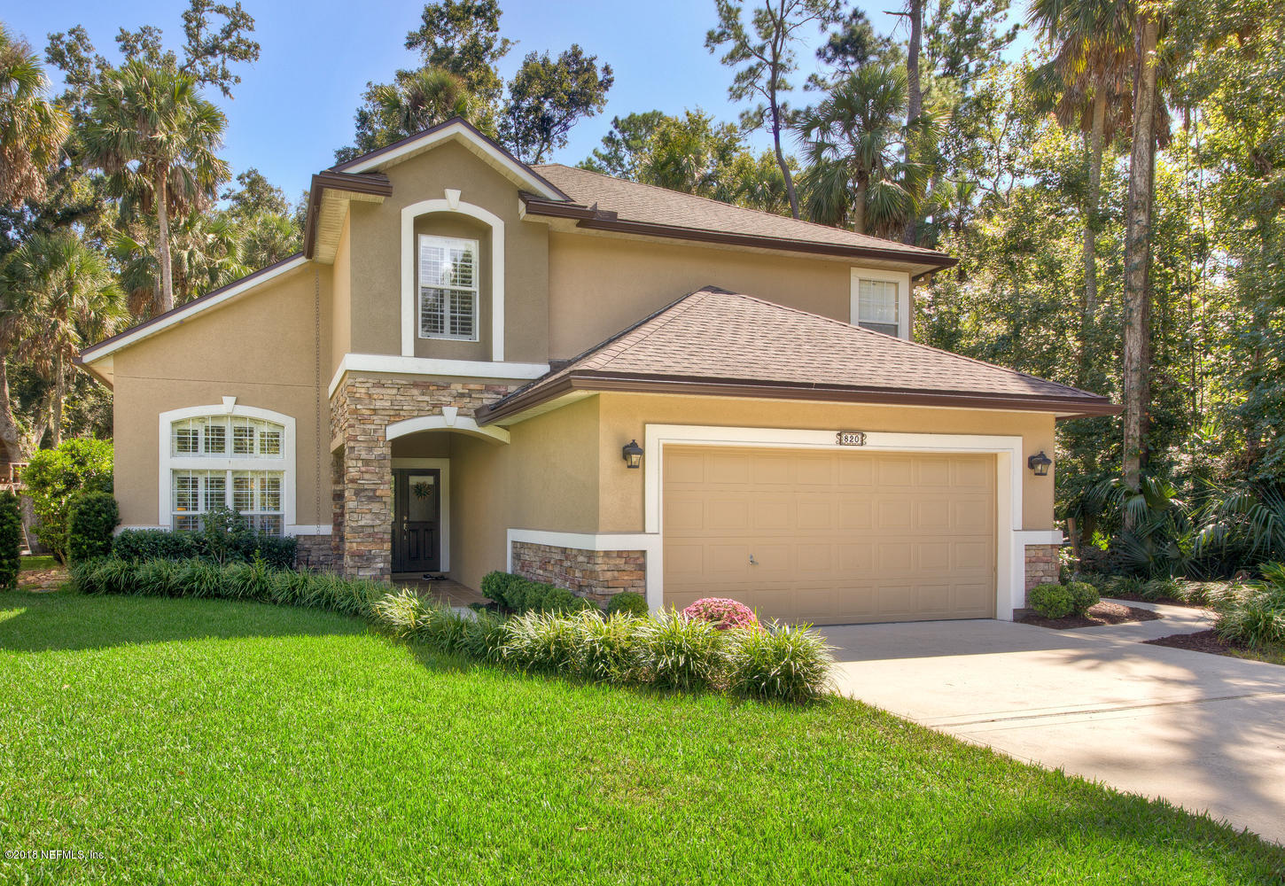820 Mill Stream Road Ponte Vedra Beach, FL 32082 - Photo 3 of 41 a front view of a house with garden