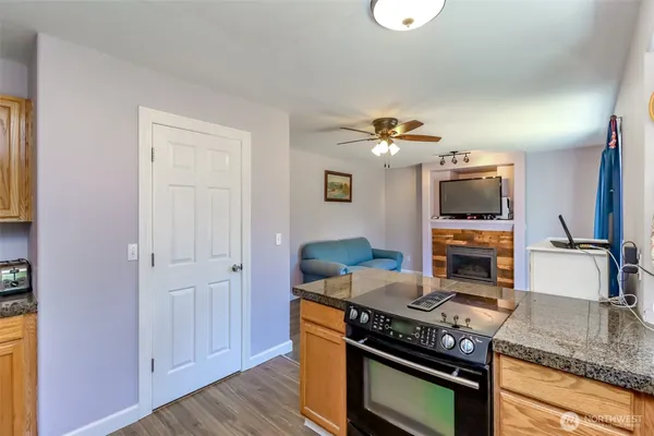 a kitchen with stainless steel appliances granite countertop a stove and a sink