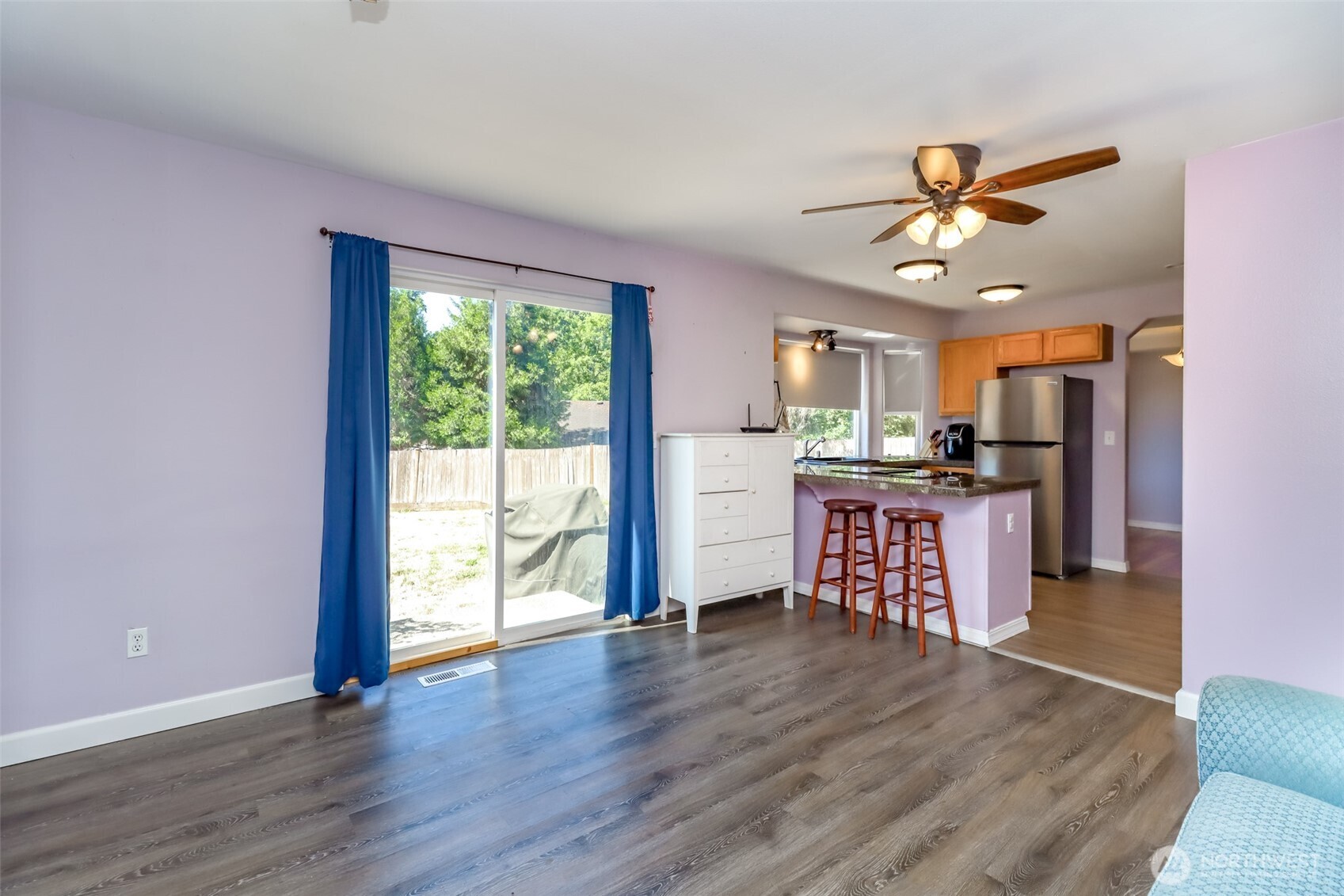 2516 Harts Lake Road South Roy, WA 98580 - Photo 15 of 40 a view of a kitchen with wooden floor and a ceiling fan