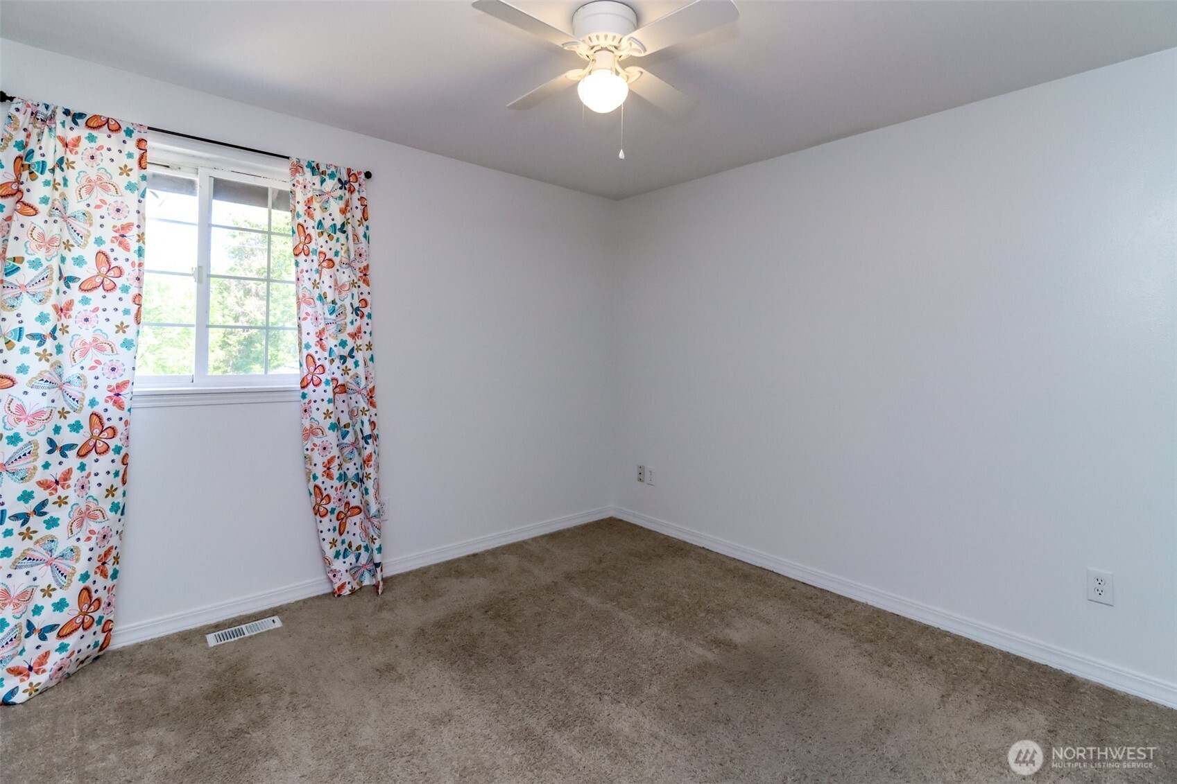 2516 Harts Lake Road South Roy, WA 98580 - Photo 22 of 40 an empty room with a window and a chandelier fan