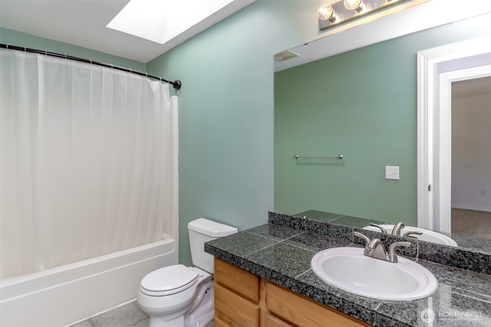 2516 Harts Lake Road South Roy, WA 98580 - Photo 24 of 40 a bathroom with a granite countertop sink toilet and a mirror