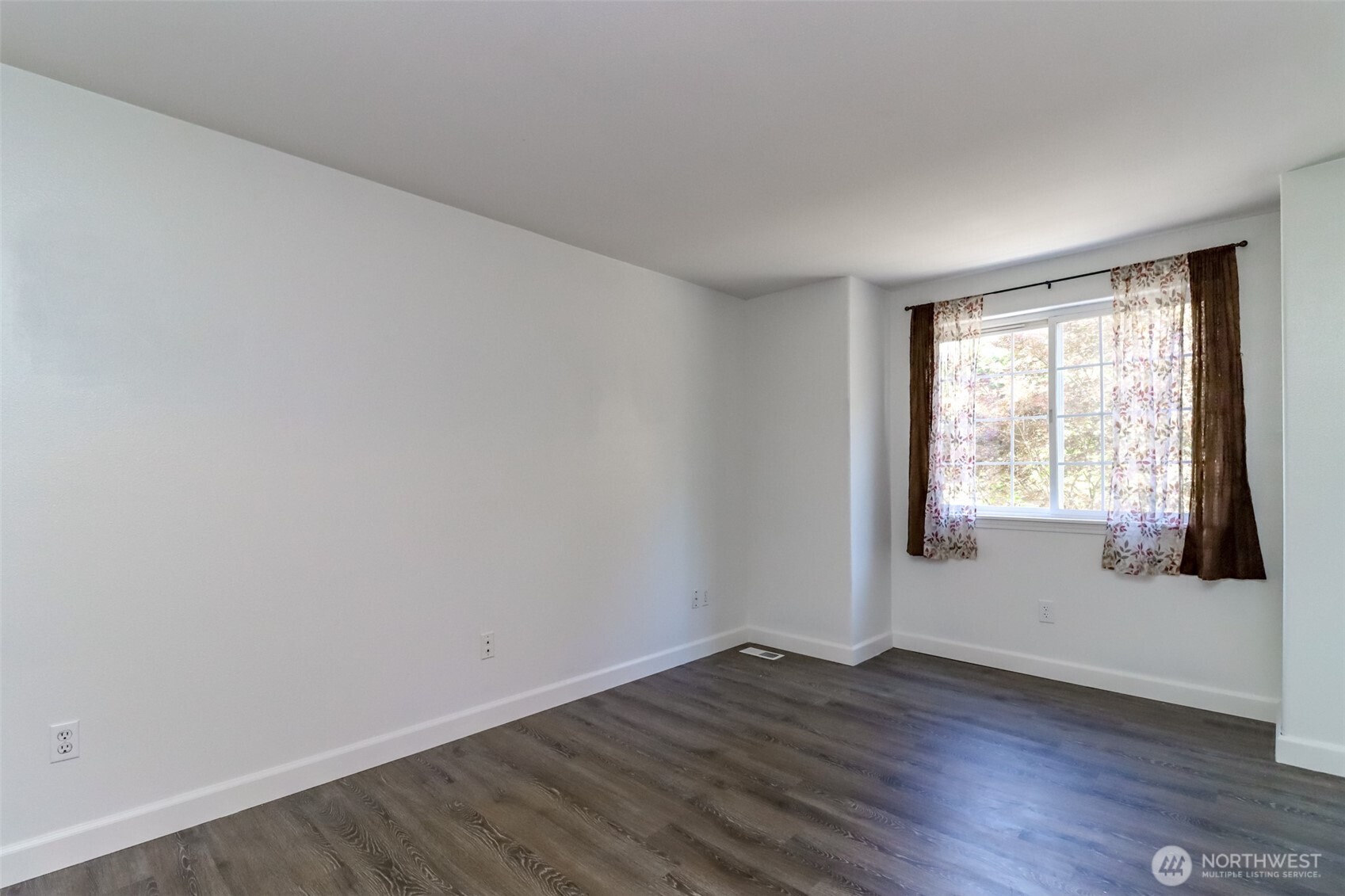 2516 Harts Lake Road South Roy, WA 98580 - Photo 26 of 40 an empty room with wooden floor and windows
