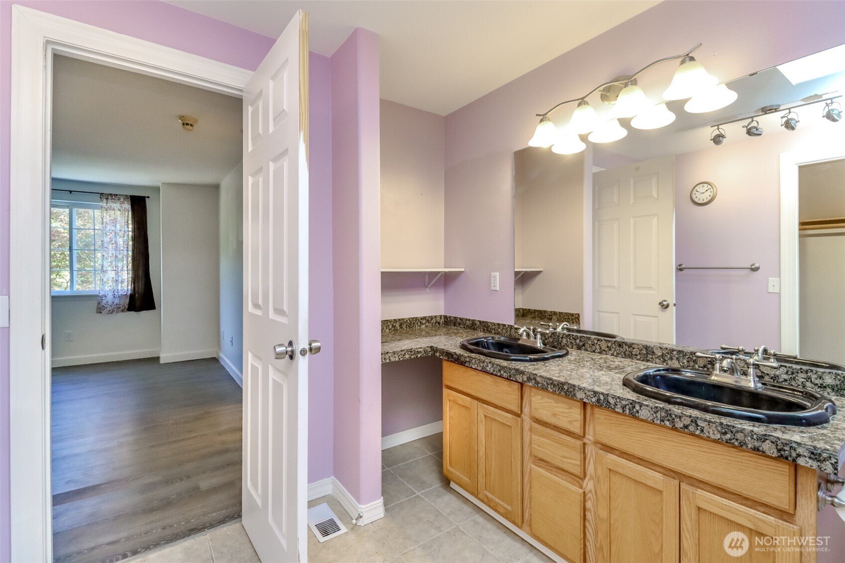 2516 Harts Lake Road South Roy, WA 98580 - Photo 29 of 40 a bathroom with a granite countertop sink a mirror and a shower