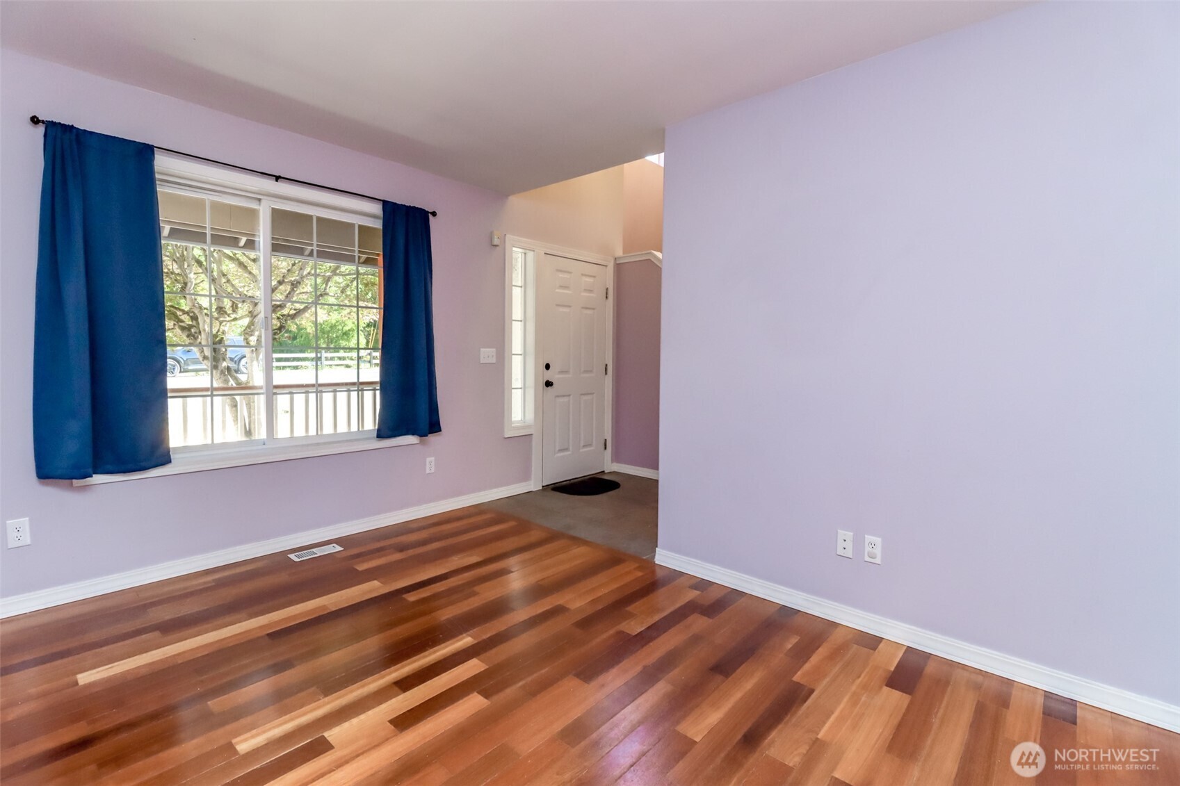 2516 Harts Lake Road South Roy, WA 98580 - Photo 5 of 40 a view of an empty room with wooden floor and a window