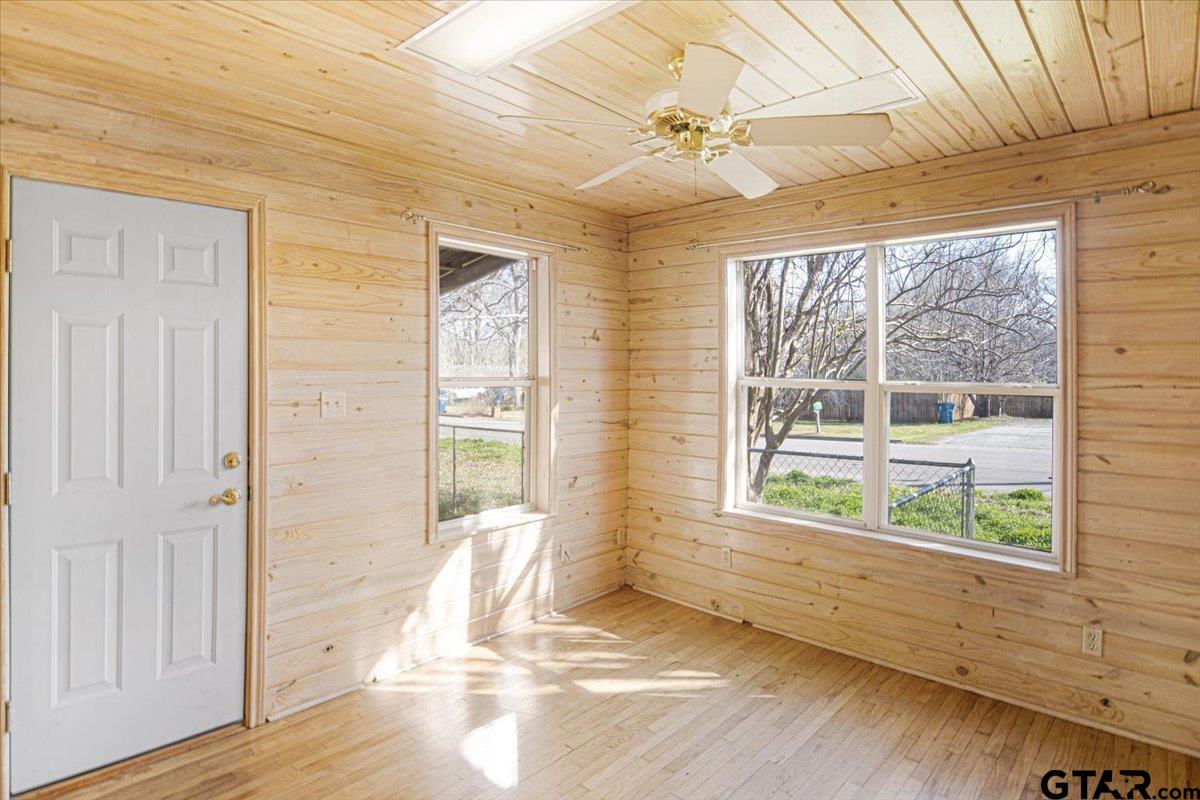504 Bascom Road Whitehouse, TX 75791 - Photo 12 of 13 a view of an empty room with wooden floor and a window