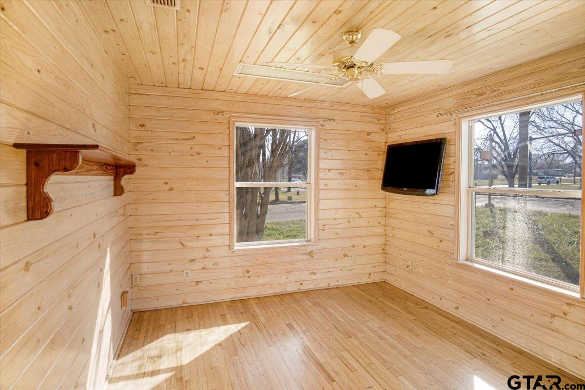 504 Bascom Road Whitehouse, TX 75791 - Photo 10 of 13 a view of a livingroom with wooden floor and a flat screen tv