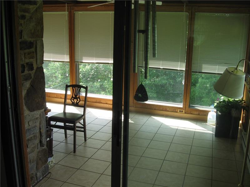 167 Big Springs Road Acme, PA 15610 - Photo 14 of 24 4 Season Room looking out on the back yard.