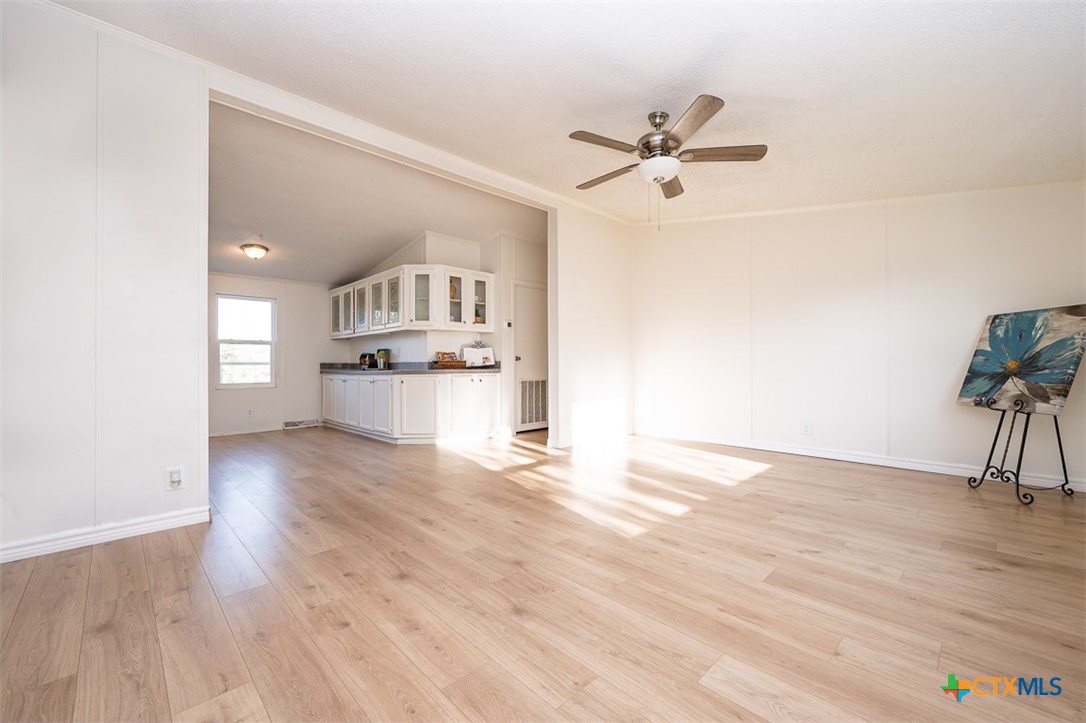 105 Grace Road Belton, TX 76513 - Photo 11 of 25 a view of a kitchen with a sink and a stove top oven