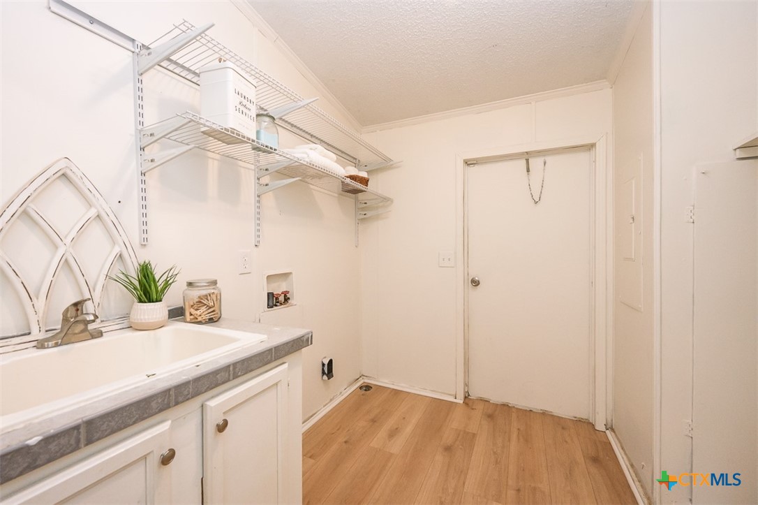 105 Grace Road Belton, TX 76513 - Photo 21 of 25 a bathroom with a sink and a mirror
