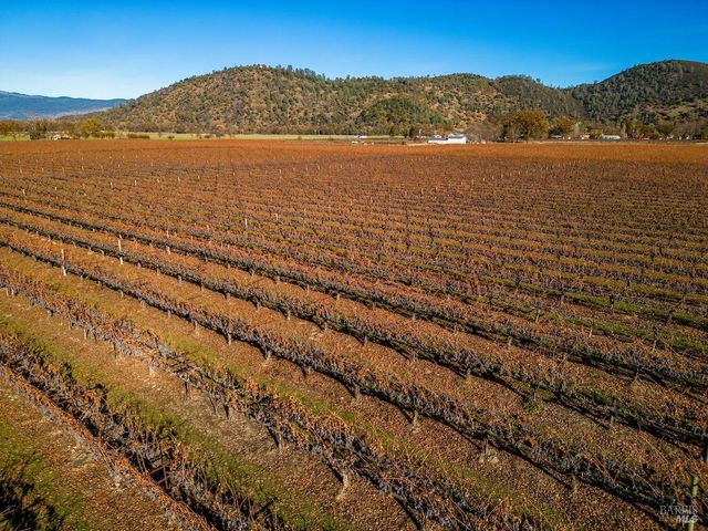 a view of an ocean with a mountain