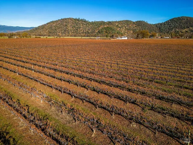 a view of an ocean with a mountain