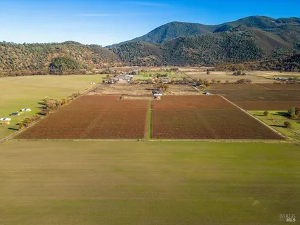 a view of an ocean and mountains