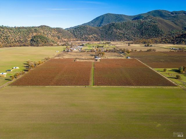a view of an ocean and mountains
