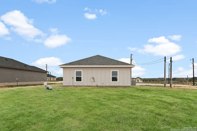 a big white house with a yard and front view