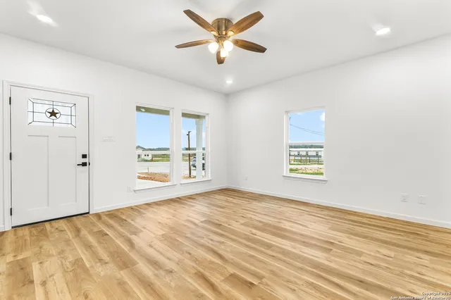 a view of an empty room and window