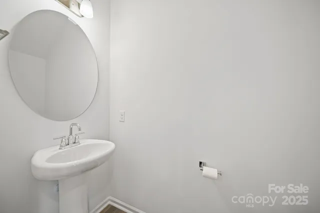 a bathroom with a sink and mirror