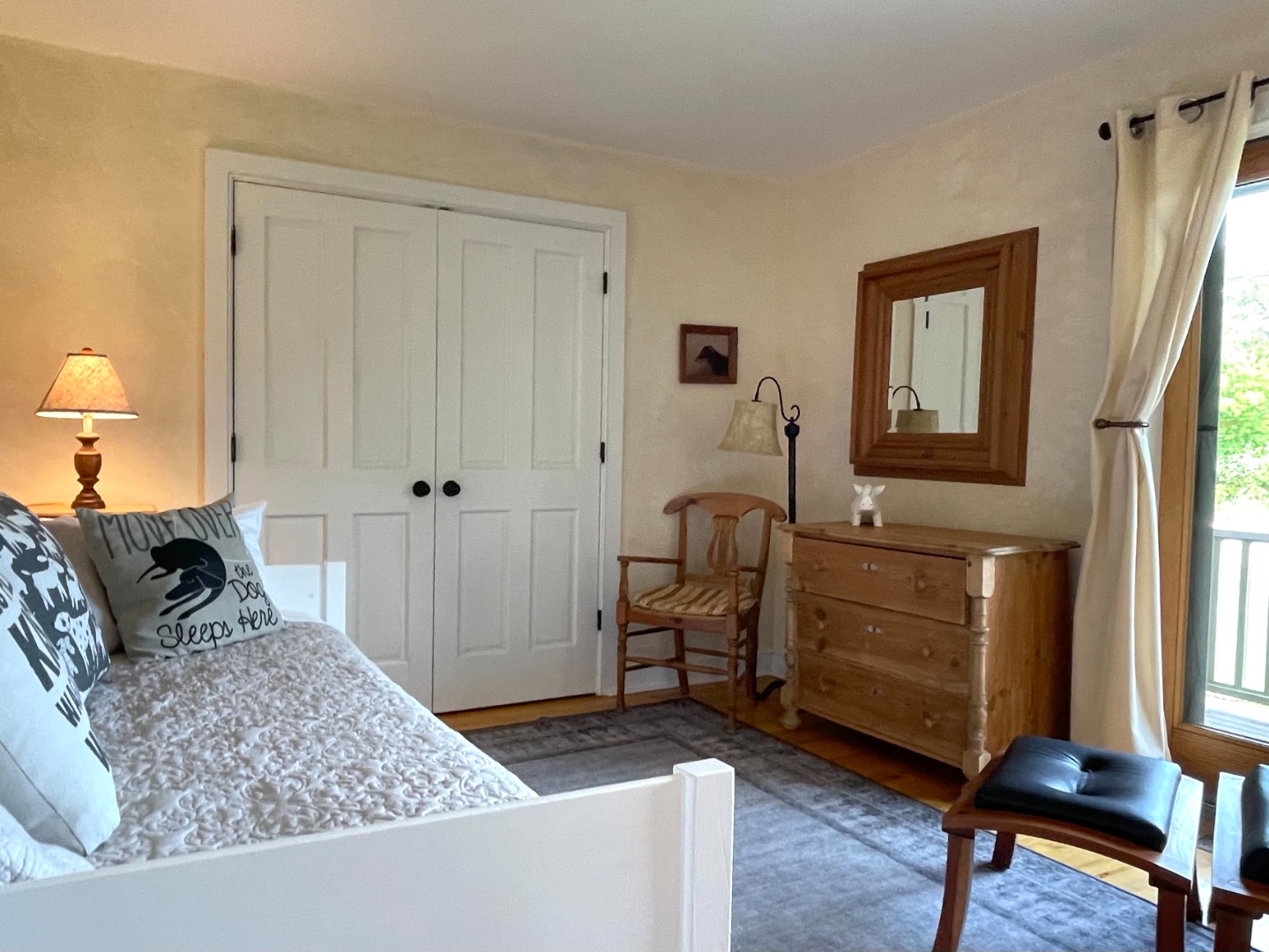 155 Surfside Road Nantucket, MA 02554 - Photo 27 of 60 a bedroom with a bed and a dresser