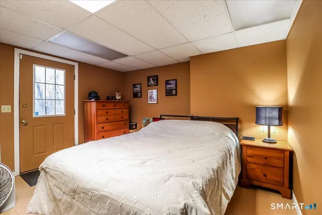 a bedroom with a bed and a dresser