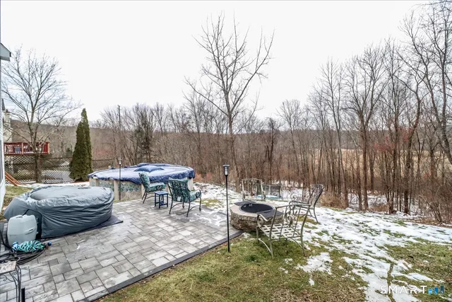 a view of a patio with a table and chairs