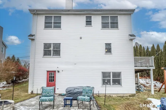 a backyard of a house with seating space