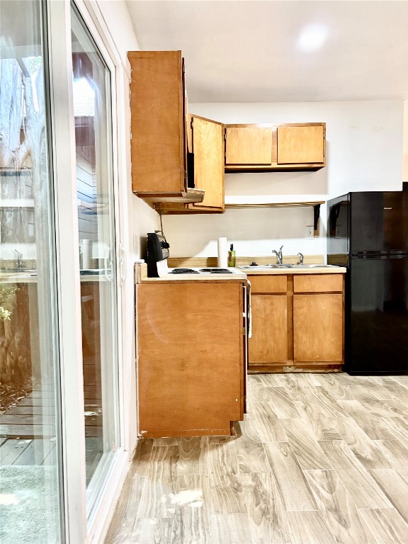 1407 Nevada Street Houston, TX 77006 - Photo 13 of 26 a kitchen with stainless steel appliances granite countertop a sink stove and refrigerator