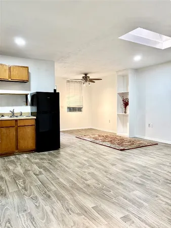 a view of a kitchen with wooden floor