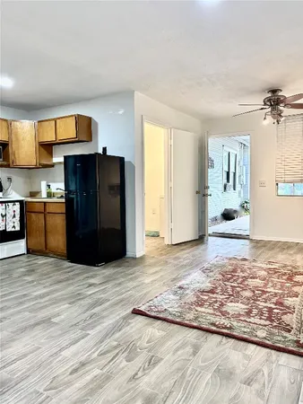 a view of a kitchen with a sink and cabinets