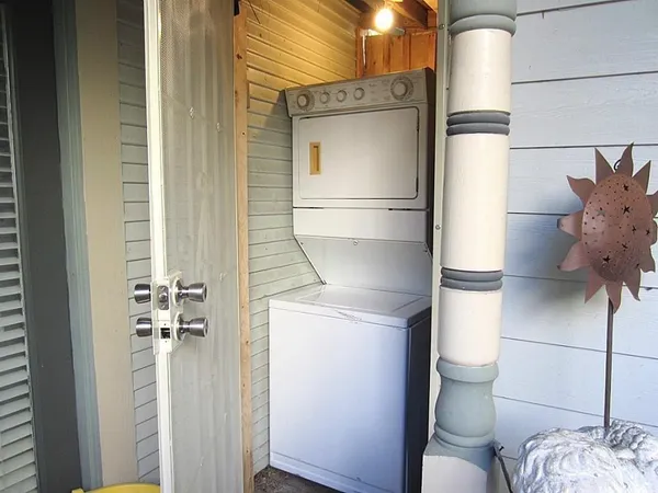 a kitchen with a refrigerator and cabinets