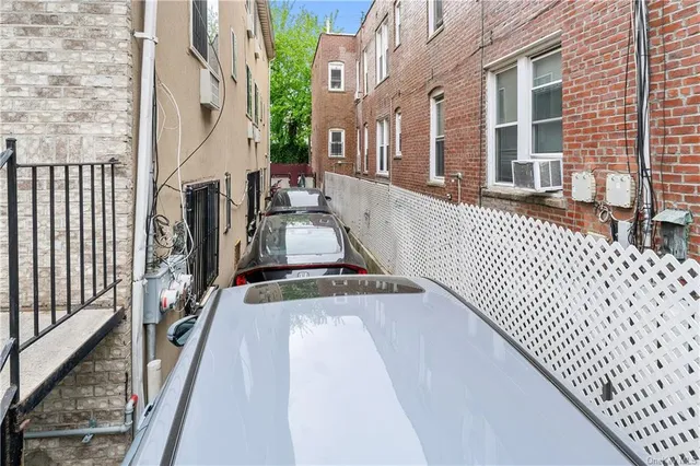 a view of a balcony with wooden floor