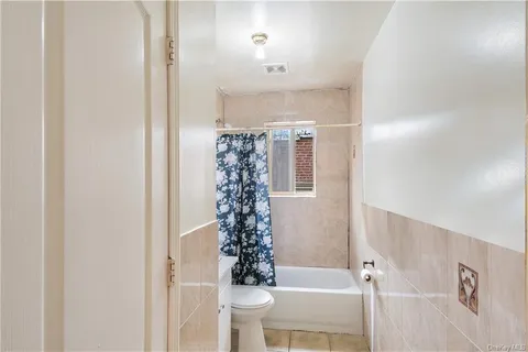 a bathroom with a bathtub a sink and a toilet