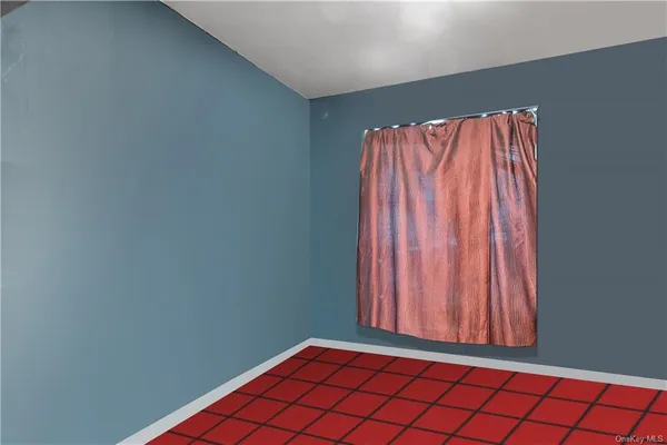 a view of a room with wooden floor and a window