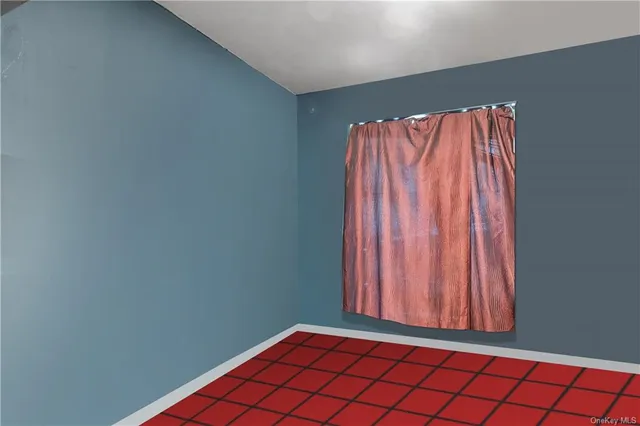 a view of a room with wooden floor and a window