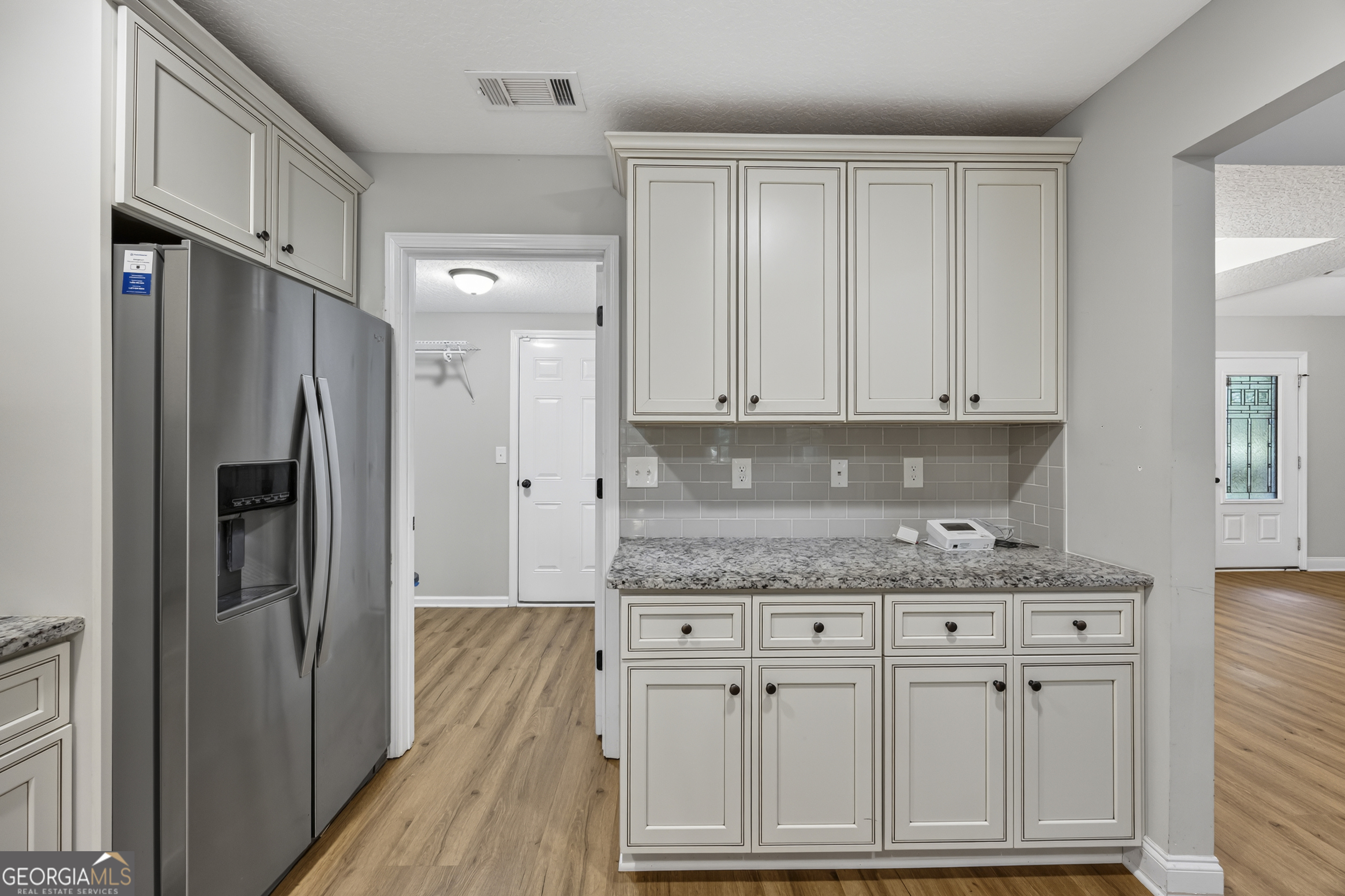 717 Oconee Lane Commerce, GA 30529 - Photo 31 of 57 a kitchen with stainless steel appliances granite countertop a refrigerator and a stove