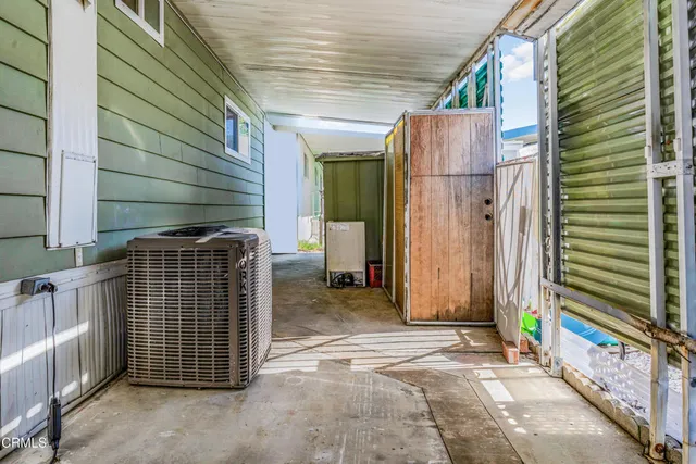 a view of a house with backyard and garage