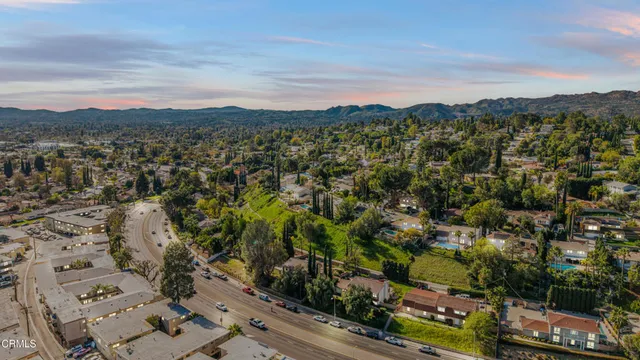 a view of a city with mountains in the background