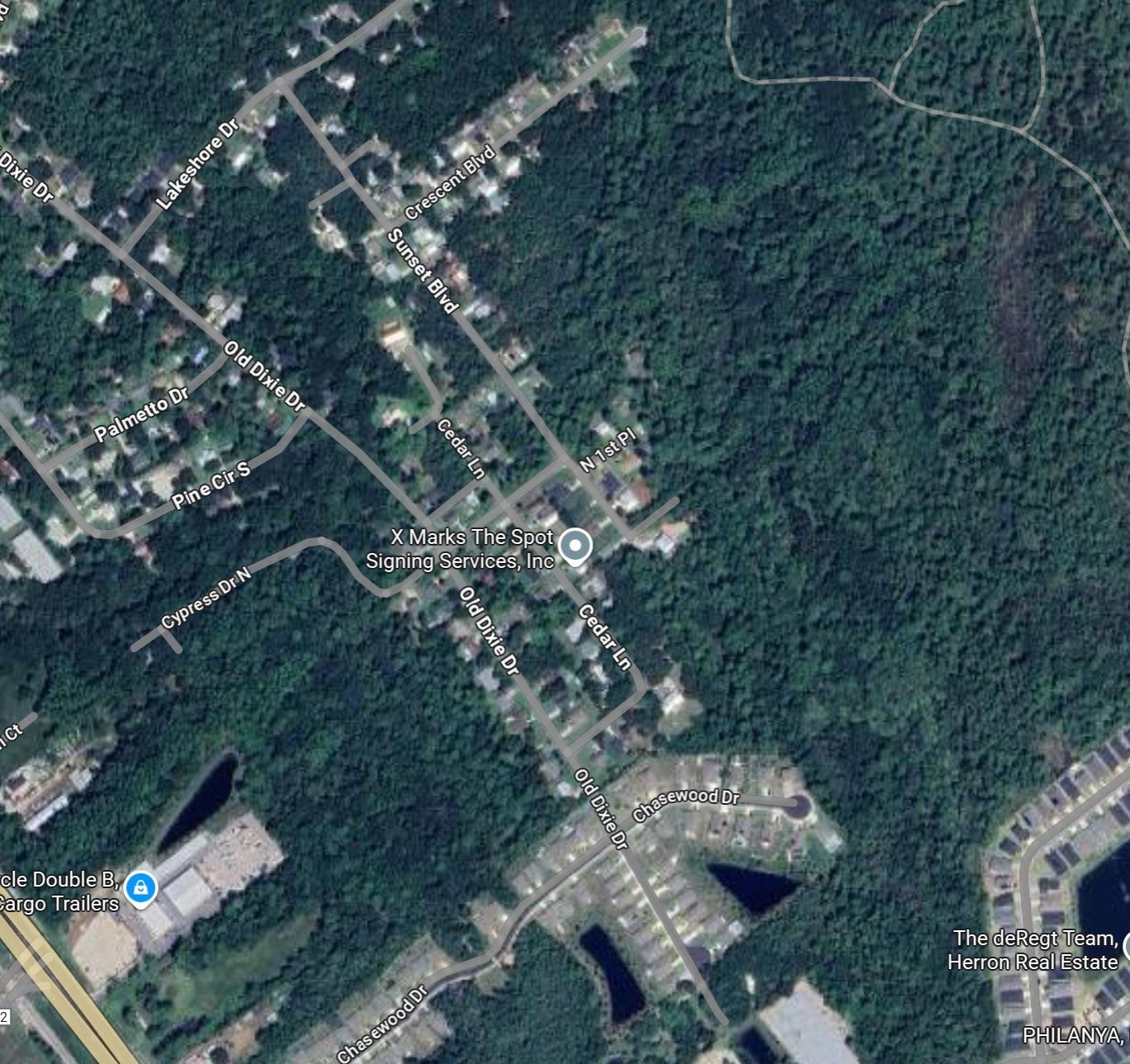 6253 West Magnolia Street St. Augustine, FL 32095 - Photo 3 of 4 a backyard of a house with lots of green space