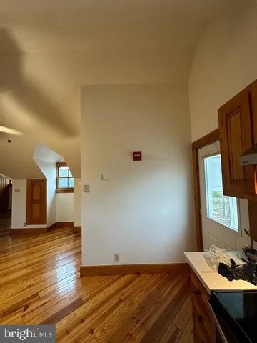 a view of a workspace with wooden floor