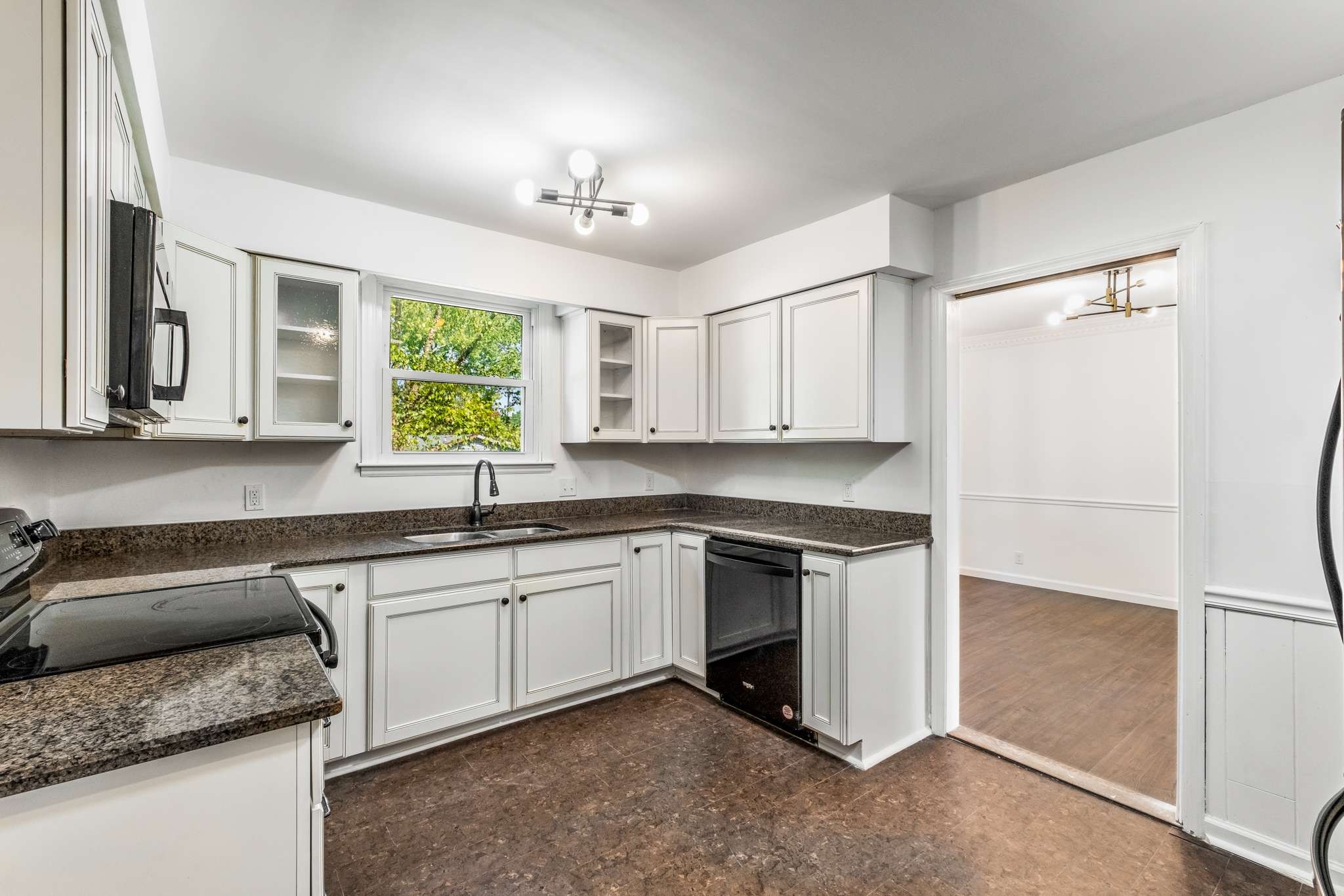 3040 Anderson Road Nashville, TN 37217 - Photo 12 of 34 a kitchen with stainless steel appliances granite countertop a sink stove and refrigerator