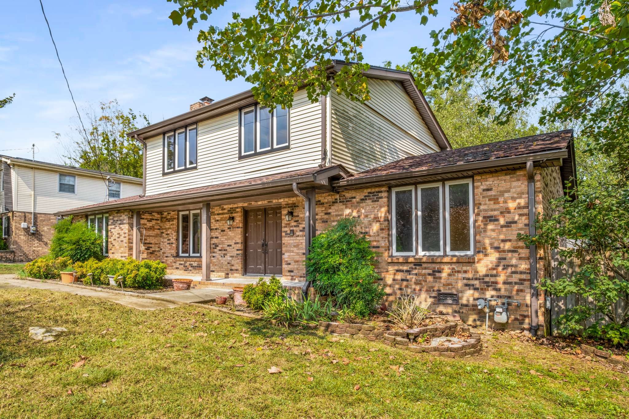 3040 Anderson Road Nashville, TN 37217 - Photo 3 of 34 a front view of a house with garden