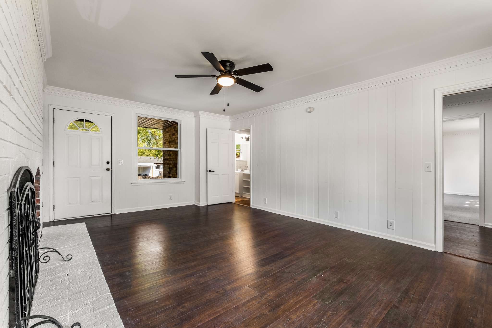 3040 Anderson Road Nashville, TN 37217 - Photo 6 of 34 an empty room with wooden floor and windows